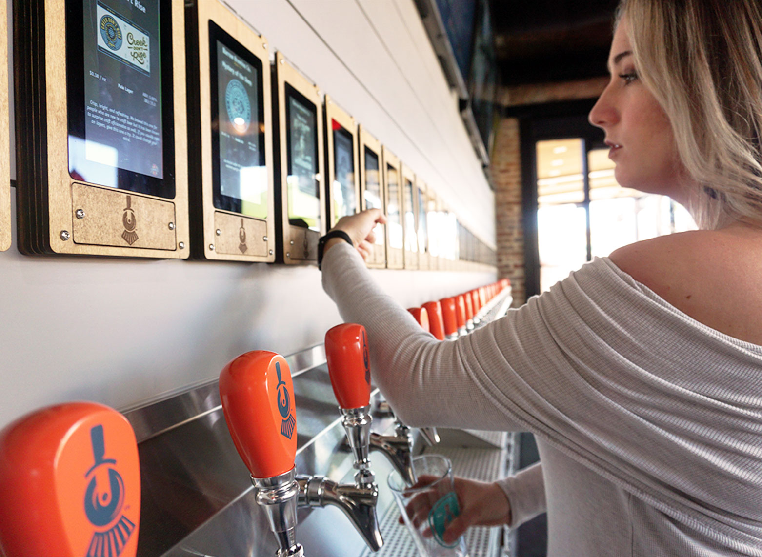 row of self-service beer taps